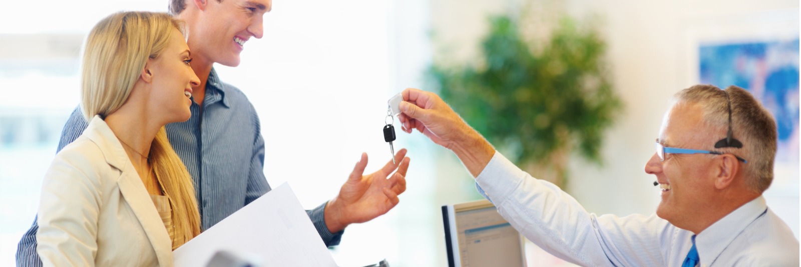 Car rental agent handing over keys